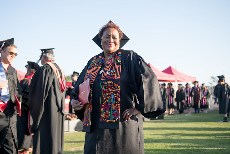 Smiling Palomar College graduate.
