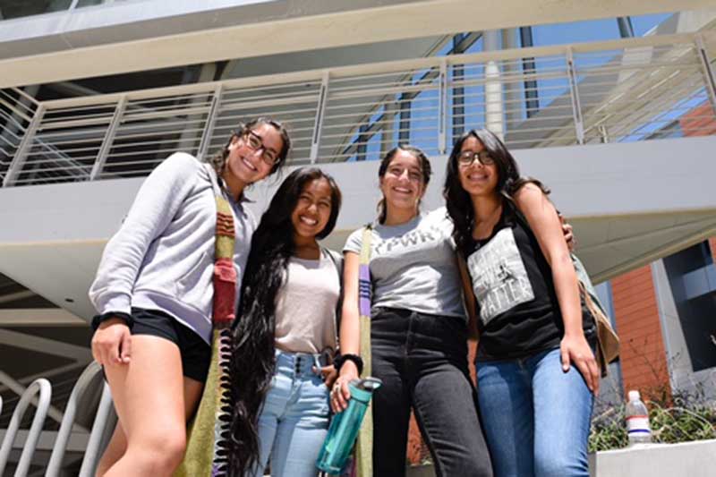 Four smiling students.