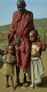 Photo of a Masai Elder with his children in Kenya