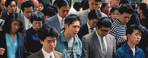 photo of Japanese adults avoiding eye contact in a crowd