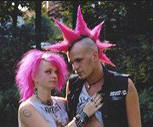 photo of two English "punkers" with spiked pink hair and tatoos