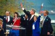 photo of President Bill Clinton waving to a croud after making a speech
