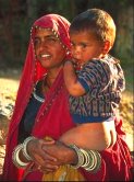 photo of a lower caste woman from Ajmer, India holding her child