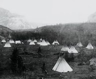 Photo of a North American Plains Indian encampment in the foothills of the Rocky Mountains