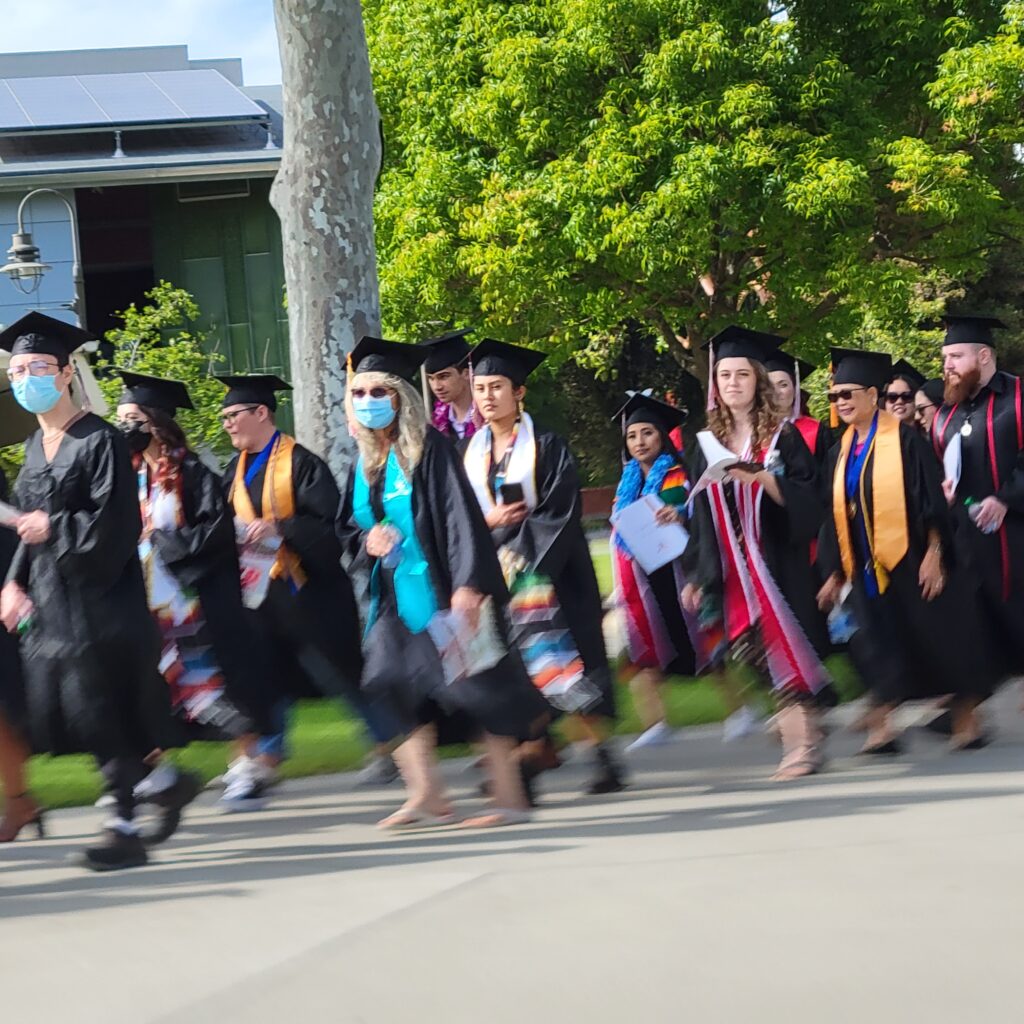 A photo of Palomar College graduates walking to commencement