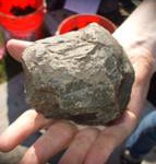 Large hammerstone in a person's hand