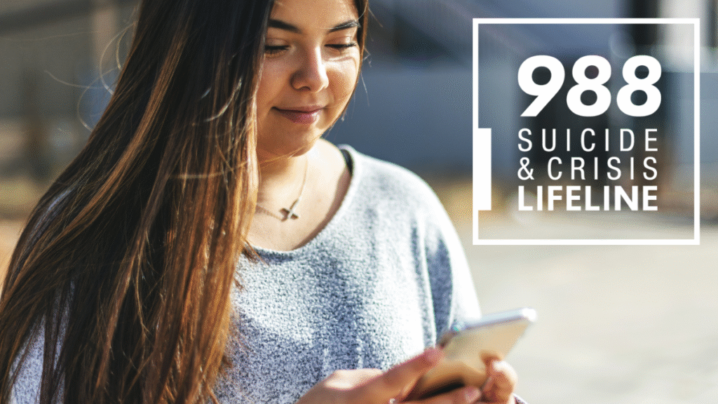Image of young adult on phone with text "988"