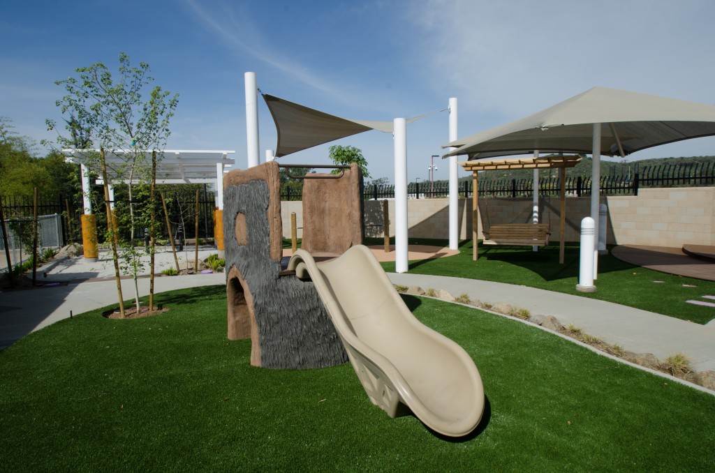 Infant playground with slide and swing.