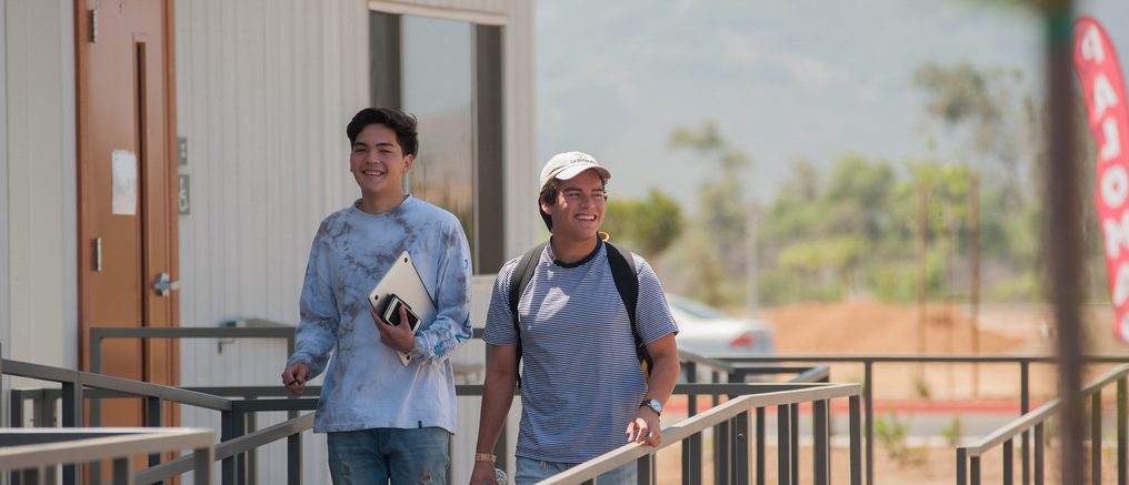 Two students going to class on the first day of the Summer 2018 semester.