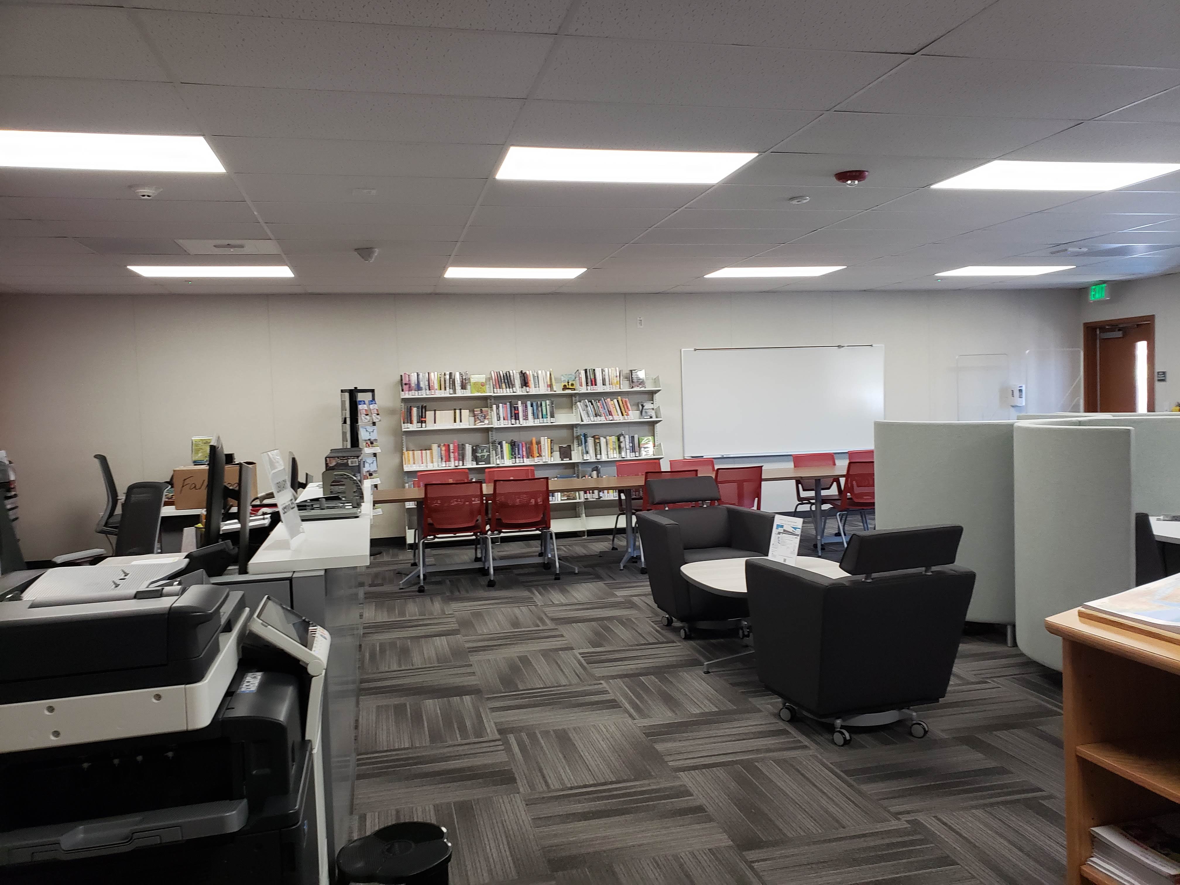 This is a photo of the Library/Teaching and Learning Center with book stacks and comfortable seating.