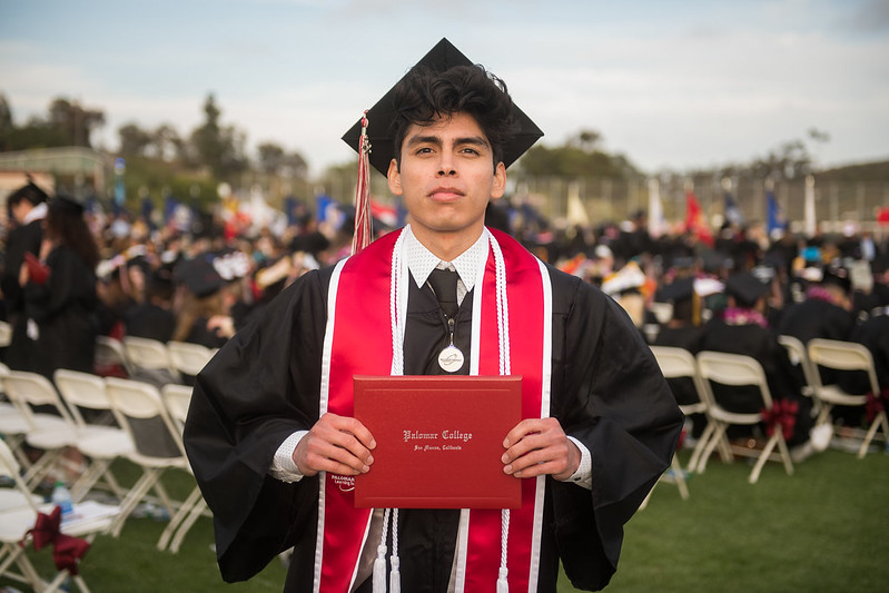 Student receiving his college diploma