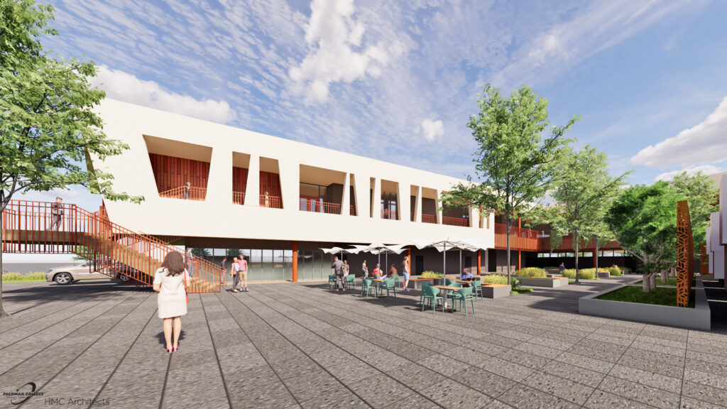 A landscaped courtyard at the Fallbrook Education Center with outdoor tables, shaded seating, walkways, and views of the Fallbrook 40 building.
