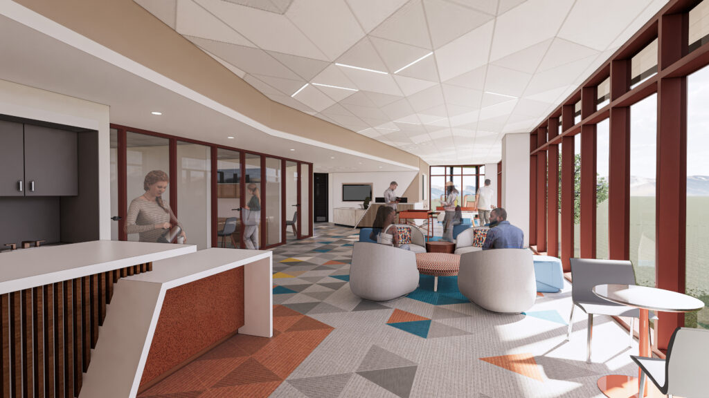 nterior view of a student lounge with flexible seating, open layout, natural lighting, and adjacent study spaces.