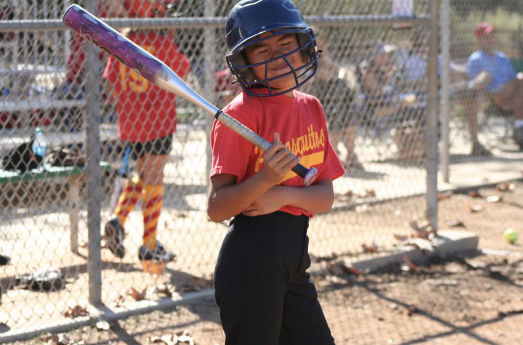 Alyssa Domingo, at age 8, is up for bat at a softball game in Escondido, Calif. (Photo courtesy of Alysssa Domingo.)