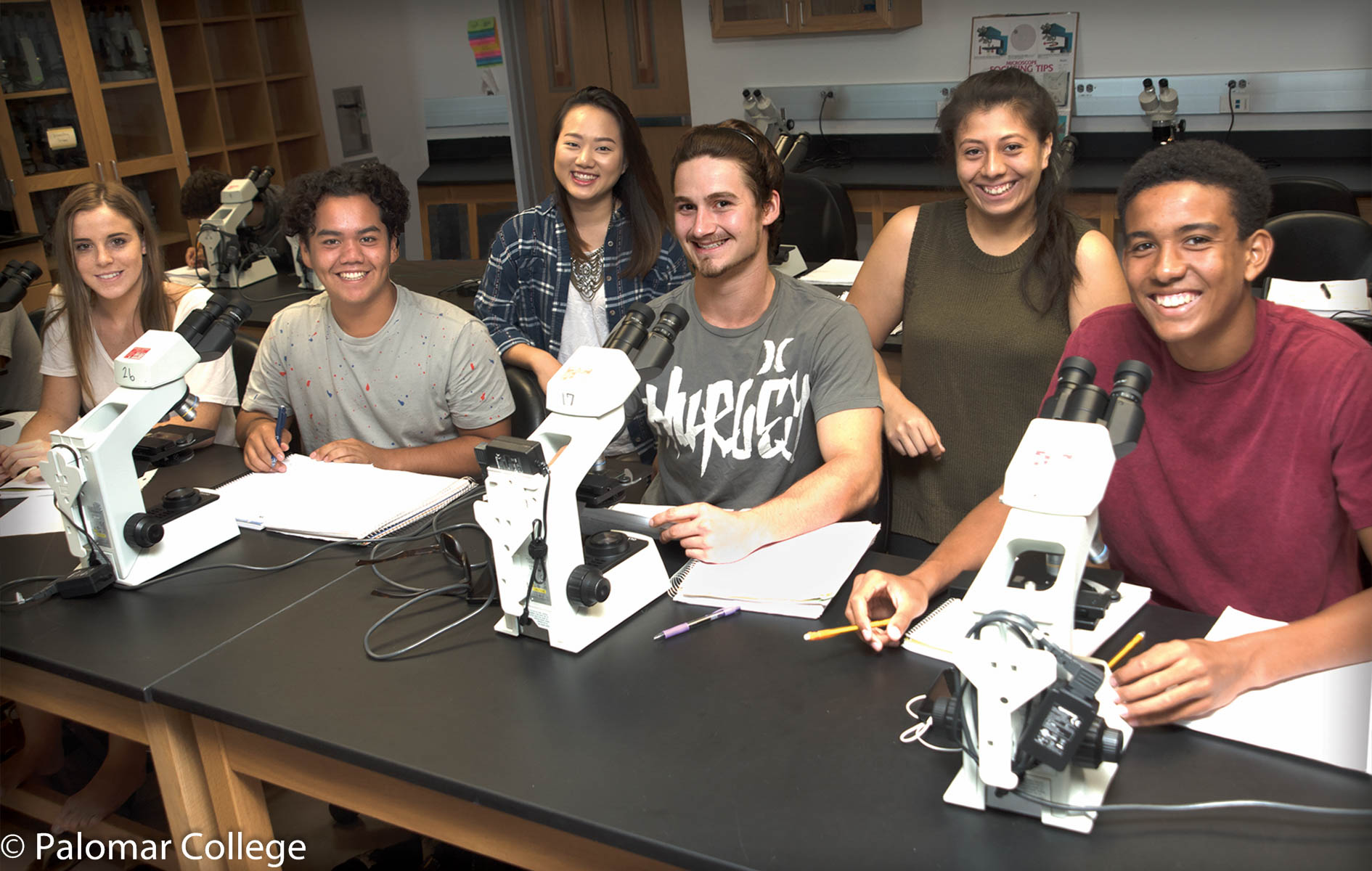 Students with microscopes
