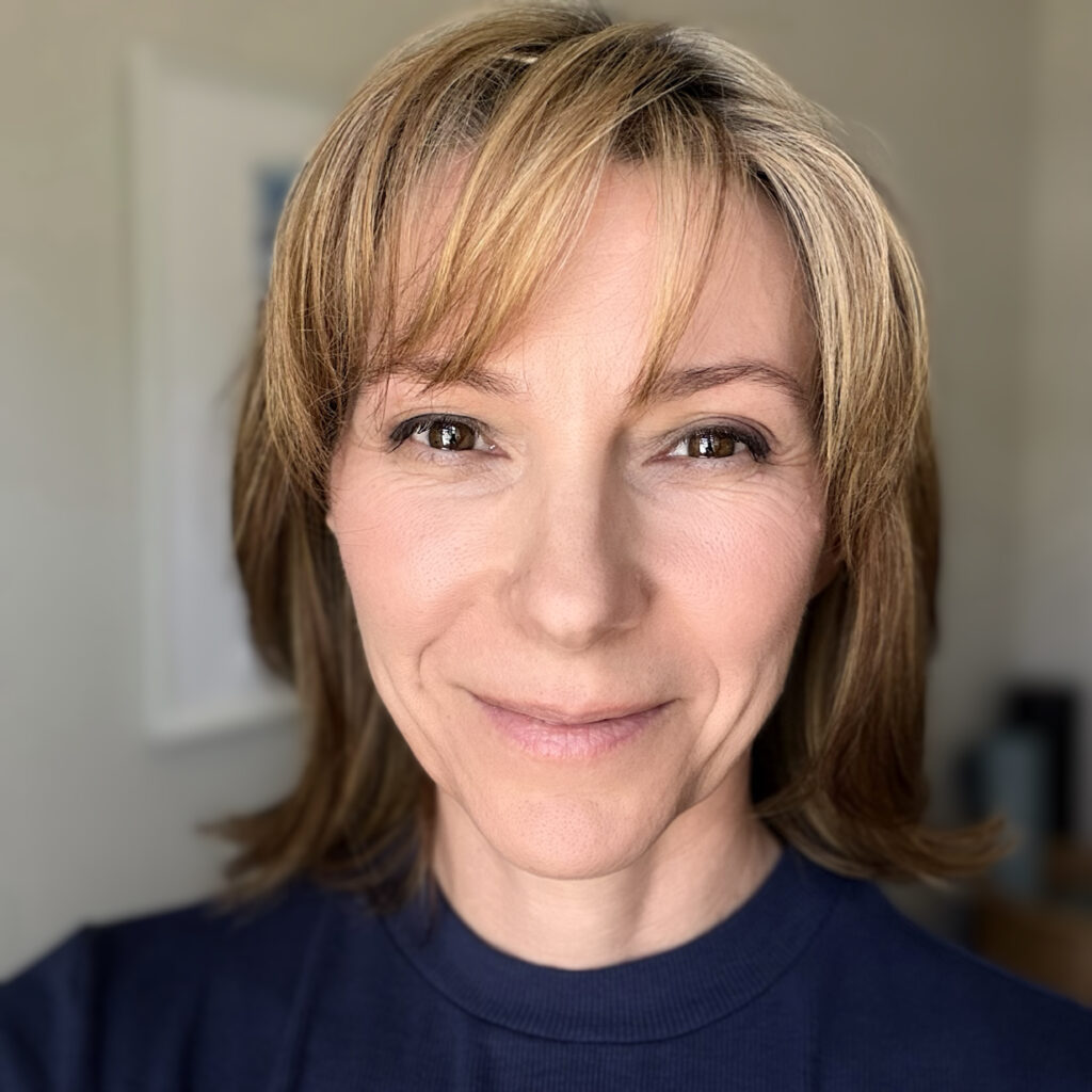 Candace Rose smiling in her headshot.