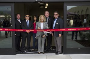 Palomar governing board behind a grand opening ribbon at the Escondido Center