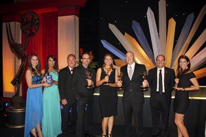 Digital Broadcast Arts faculty and students holding awards at the Emmy's