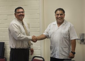 Palomar College Governing Board President congratulating he College’s incoming Interim Superintendent/President