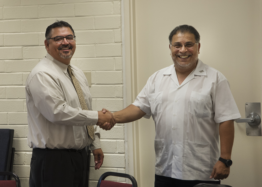 Palomar College Governing Board President congratulating he College’s incoming Interim Superintendent/President