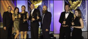 Digital Arts Broadcast Students and faculty holding awards at the Emmy's