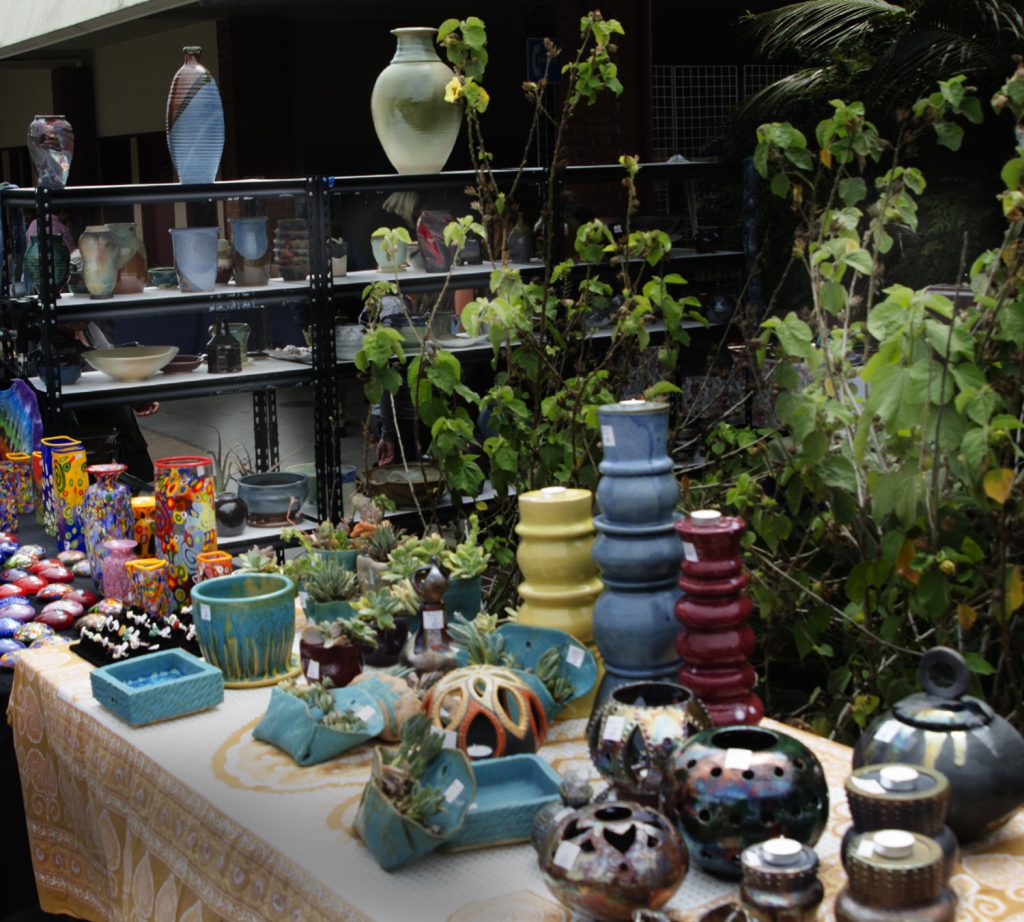 Table filled with items for the art sale