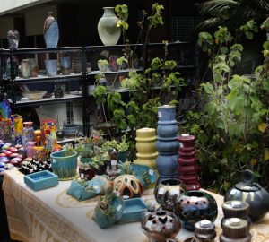 Table filled with items for the art sale