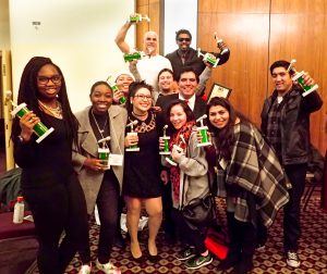 Group of staff members from the Palomar College Radio Station KKSM holding trophies and celebrating