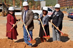 Palomar leadership shoveling dirt and a groundbreaking ceremony