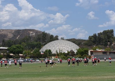 Palomar football team practicing on the field