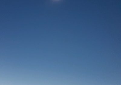 View of the solar Eclipse in a semi darkened sky