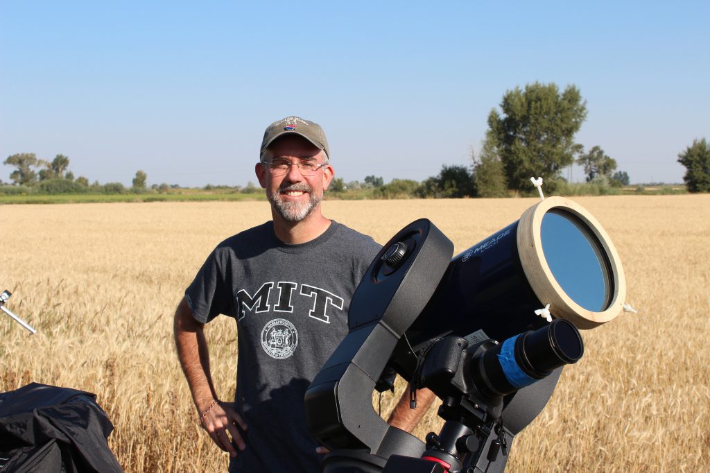 Palomar College astronomy professor with his telescope and photography equipment, awaiting the eclipse