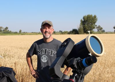 Palomar College astronomy professor with his telescope and photography equipment, awaiting the eclipse