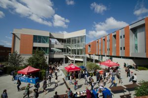 Students walking around a busy campus