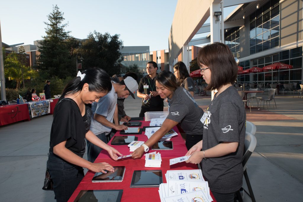 Volunteers assisting with check-in at event