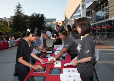 Volunteers assisting with check-in at event