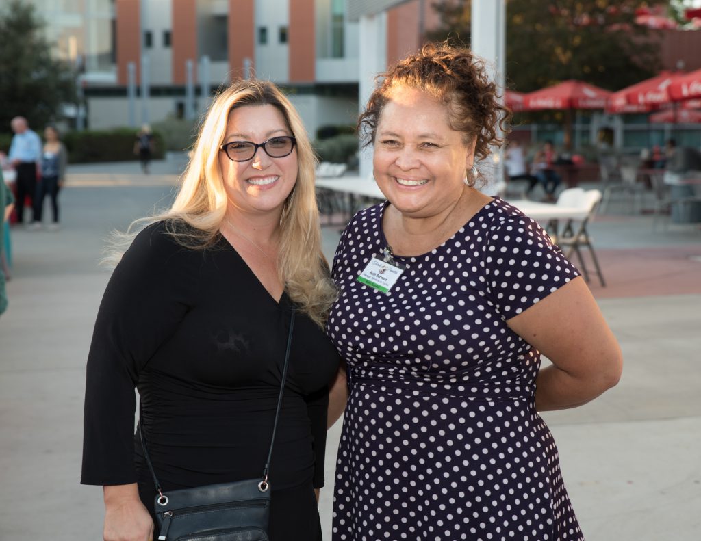 Two attendees at Guests attending the Tarde de Familia event