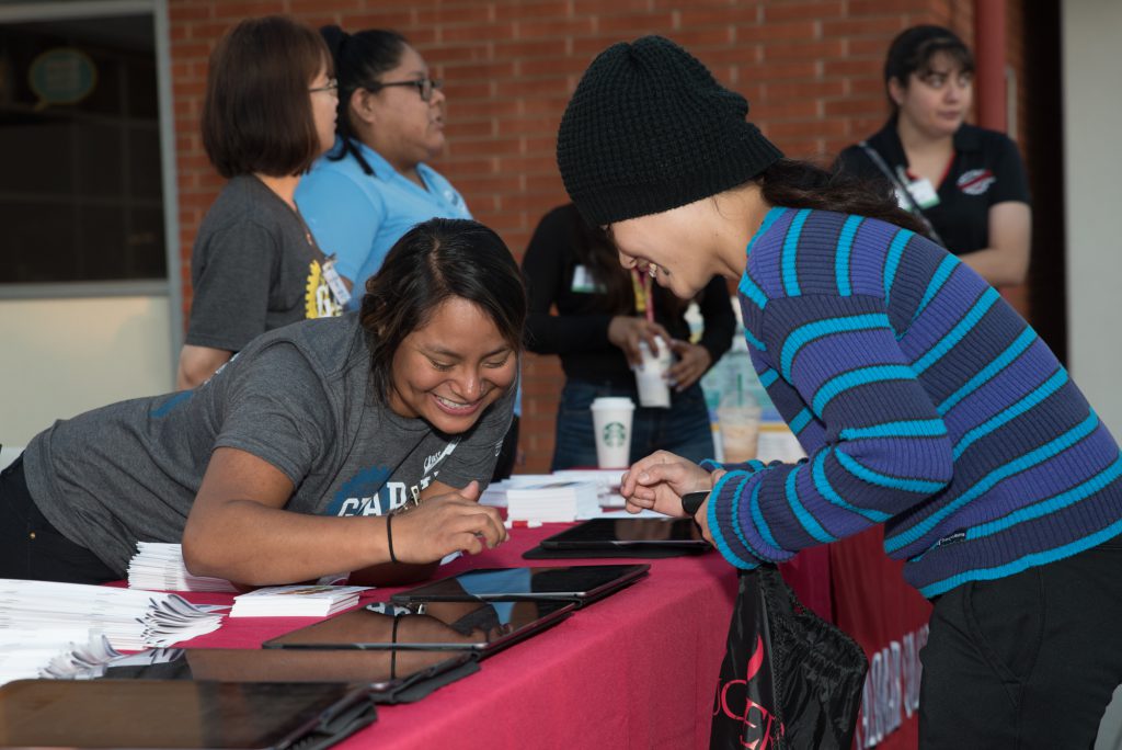 Volunteers at event helping guests check in
