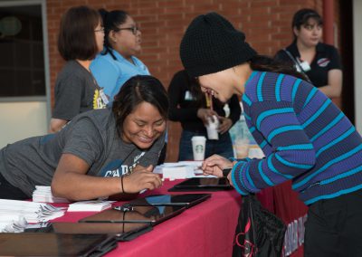 Volunteers at event helping guests check in