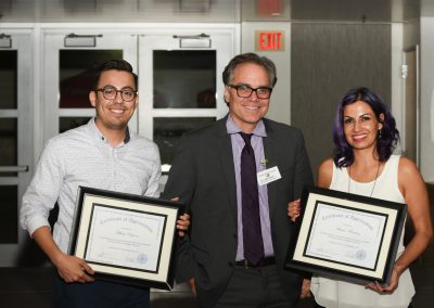 Special guest speakers holding Certificates of Appreciation and standing with Dr. Jack Kahn