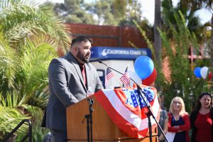 Male speaker at podium during the Veterans Day ceremony event