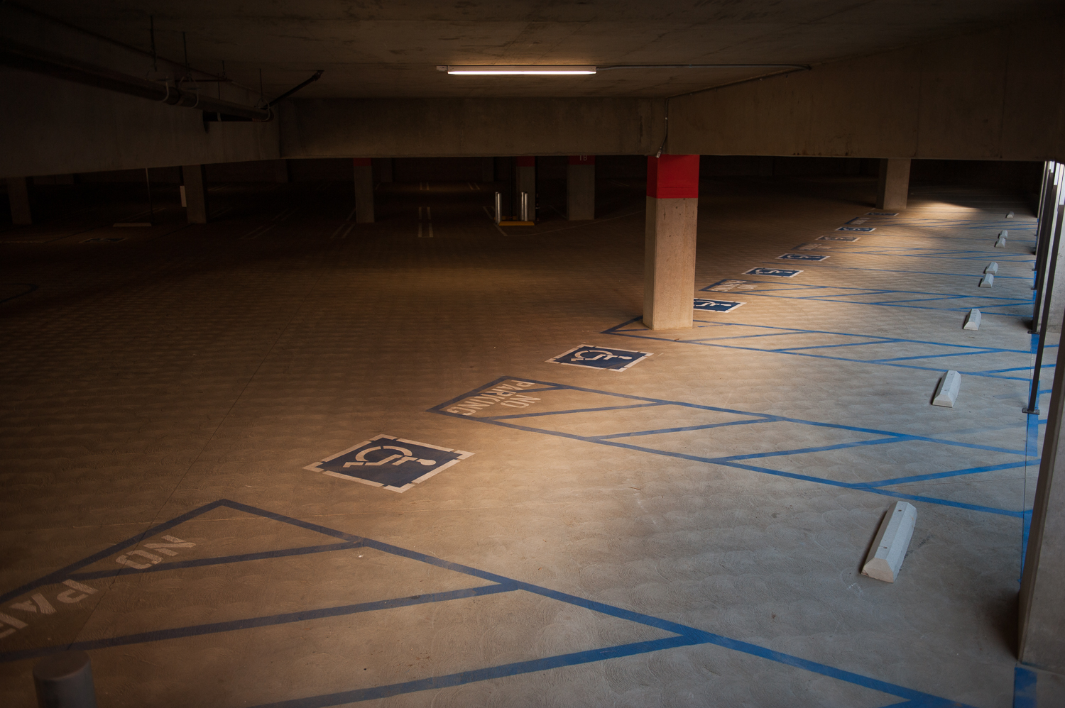 View of empty parking stalls in parking garage