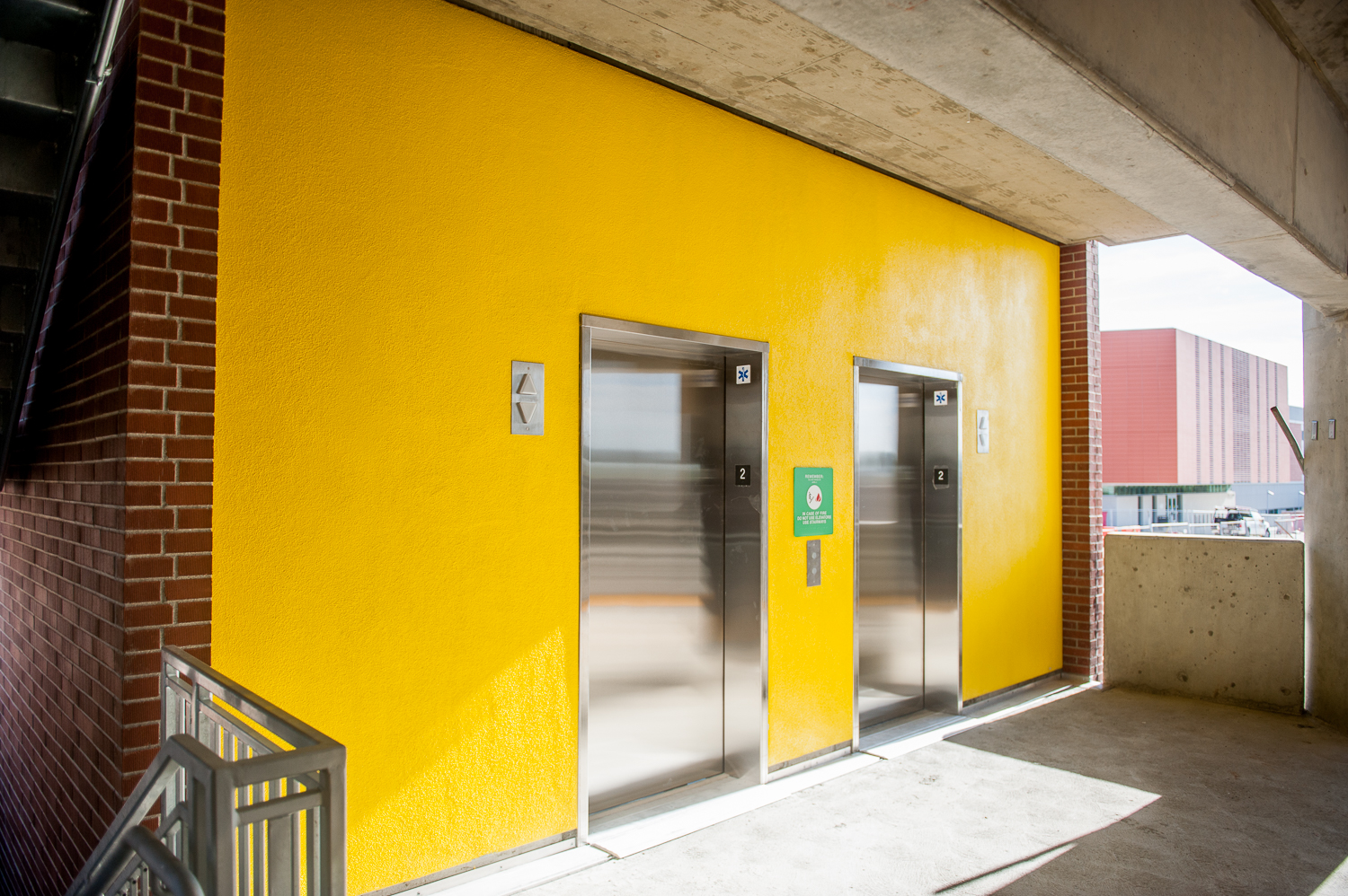 View of elevator doors in parking garage