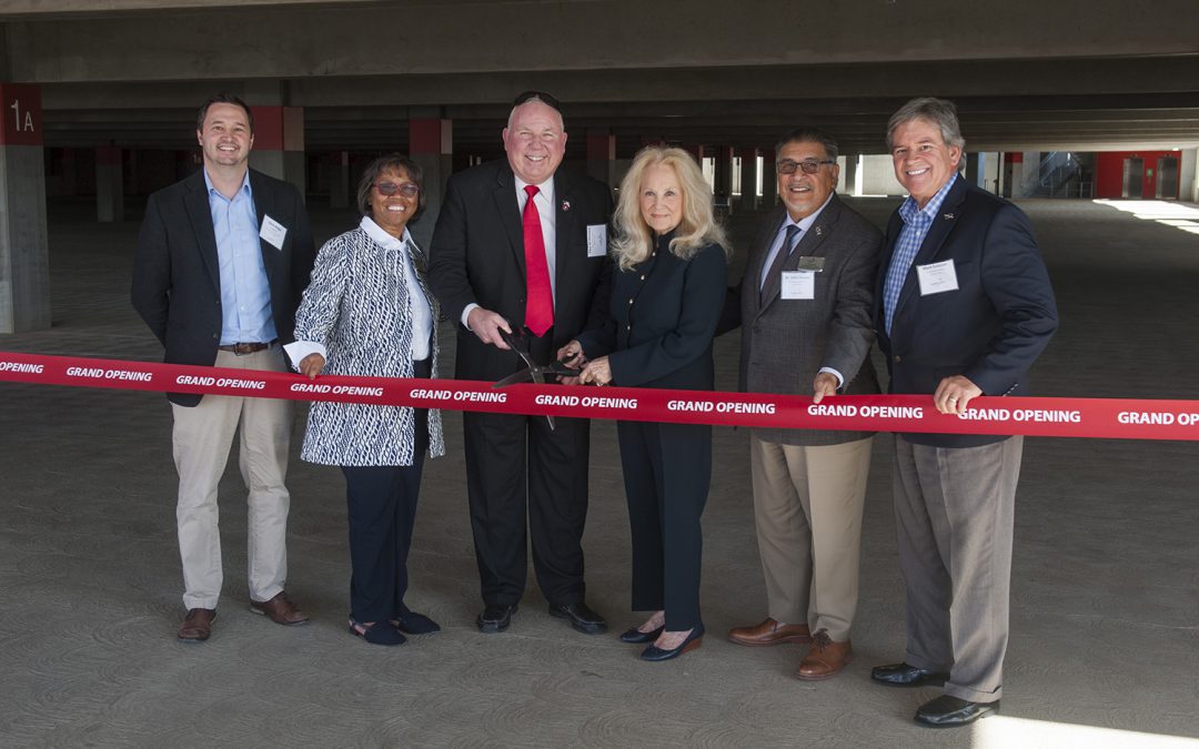 Palomar leadership cutting red grand opening ribbon in the new parking structure