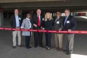 Palomar leadership cutting red grand opening ribbon in the new parking structure