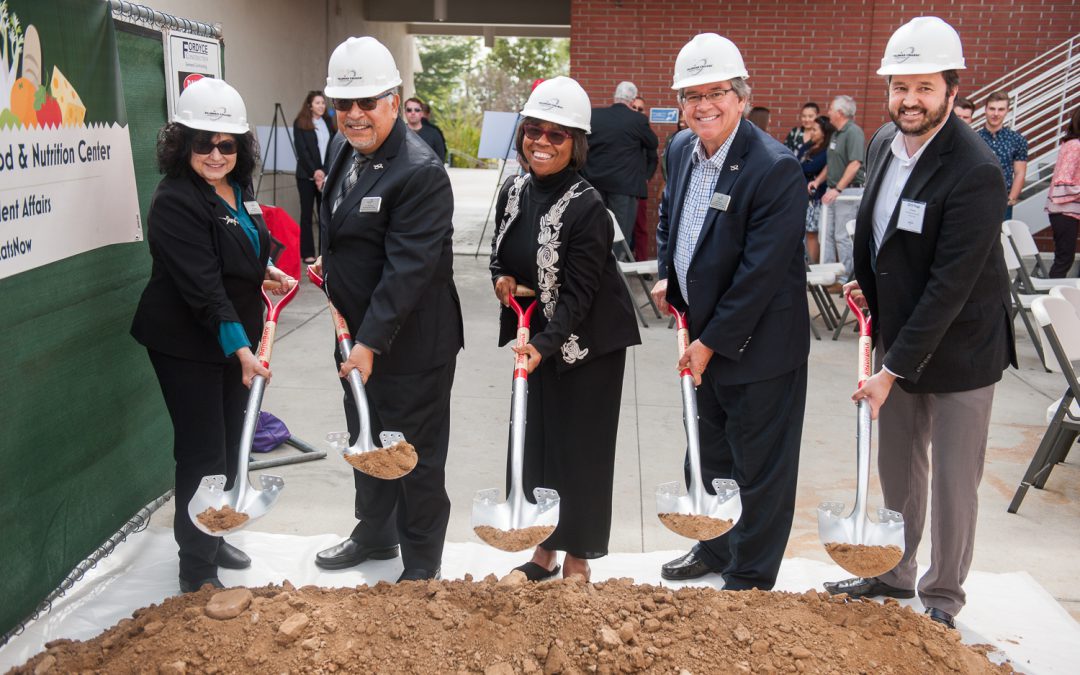 Palomar leadership holding shovels and breaking ground at the Food and Nutrition Center