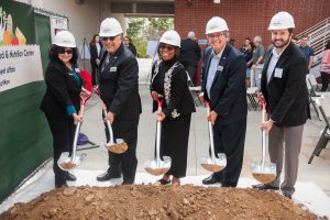 Palomar leadership holding shovels and breaking ground at the Food and Nutrition Center