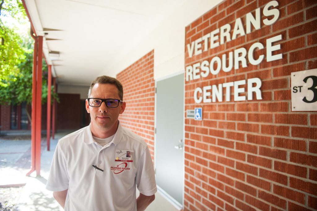 Army Veteran and former Palomar student Nicholas Williams standing outside of the Veterans Resource Center building
