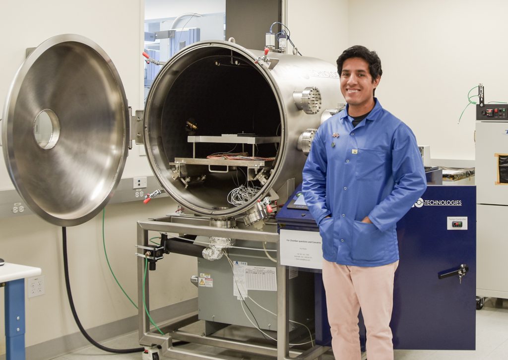 Palomar College alumnus Yuri Rodea standing in a technology lab