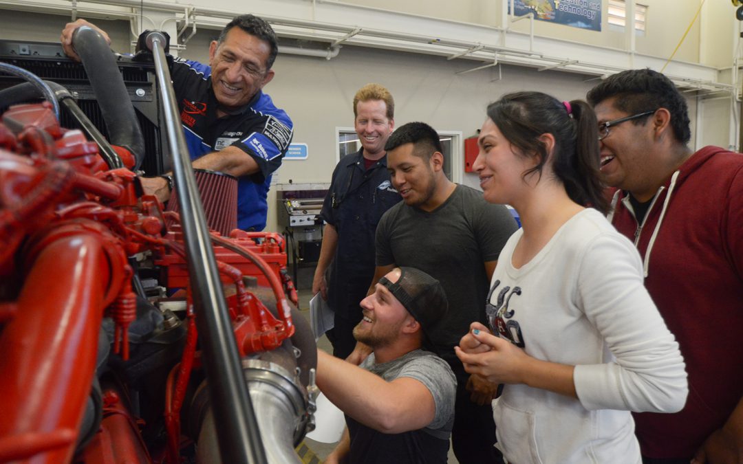 Students engaged in a hands on lesson in Diesel Technology class